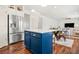 Spacious kitchen with a large island, stainless steel appliances, and a seamless transition to the living area at 1560 Avalon Creek Rd, Sugar Hill, GA 30518
