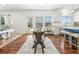 Open-concept kitchen with a center island, stainless steel appliances, and seamless access to the living area at 1560 Avalon Creek Rd, Sugar Hill, GA 30518