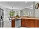 Bright kitchen with stainless steel appliances and view of a breakfast nook at 5303 Davenport Mnr, Cumming, GA 30041