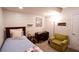 Cozy bedroom featuring a twin bed, study desk, and comfortable armchair at 110 Sandy Ridge Trl, Fayetteville, GA 30214