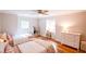 Charming shared bedroom with hardwood floors, two twin beds, and a dedicated study nook at 110 Sandy Ridge Trl, Fayetteville, GA 30214