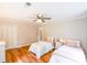Inviting shared bedroom featuring two beds, hardwood floors, and ample closet space at 110 Sandy Ridge Trl, Fayetteville, GA 30214