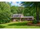 Traditional brick home with a manicured front lawn and colorful shrubbery at 110 Sandy Ridge Trl, Fayetteville, GA 30214