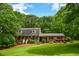 Inviting two-story home featuring well-maintained landscaping and classic brick facade at 110 Sandy Ridge Trl, Fayetteville, GA 30214