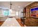 Bright kitchen with stainless steel appliances and a spacious island with stone countertops at 110 Sandy Ridge Trl, Fayetteville, GA 30214