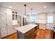Contemporary kitchen features stainless steel appliances, modern cabinetry, and a center island at 110 Sandy Ridge Trl, Fayetteville, GA 30214