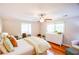 Bright main bedroom with hardwood floors offers ample space, natural light and dedicated desk area at 110 Sandy Ridge Trl, Fayetteville, GA 30214