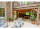 Relaxing outdoor patio with comfortable seating and a covered hot tub area at 110 Sandy Ridge Trl, Fayetteville, GA 30214