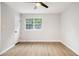 This bedroom features wood-look flooring and fresh white walls with a closet on the far wall at 1225 Church St # A, Decatur, GA 30030