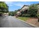 Apartment complex with brick and Tudor style architecture, set in a well-maintained, tree-lined community at 1225 Church St # A, Decatur, GA 30030