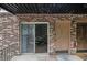 Charming brick apartment building featuring sliding glass door, entrance and cozy outdoor patio at 1225 Church St # A, Decatur, GA 30030