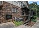 Brick apartment building showcasing exterior stairs leading to a balcony and outdoor living spaces at 1225 Church St # A, Decatur, GA 30030
