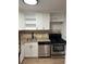 The kitchen has stainless steel appliances, granite countertops, and modern cabinetry at 1225 Church St # A, Decatur, GA 30030