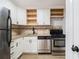 Updated kitchen with stainless steel appliances, granite counters, and modern cabinets at 1225 Church St # A, Decatur, GA 30030