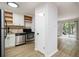 Open kitchen featuring stainless steel appliances, granite countertops, and white cabinetry at 1225 Church St # A, Decatur, GA 30030
