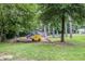 Community playground with play structures set amidst mature trees and landscaping at 1225 Church St # A, Decatur, GA 30030