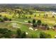 Scenic aerial view of the golf course with mature trees and sand traps near the property at 1585 San Gabriel Ave, Decatur, GA 30032
