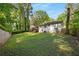 Large backyard with trees, fencing, and exterior house view at 1585 San Gabriel Ave, Decatur, GA 30032