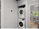 Updated bathroom featuring a stacked washer and dryer, adding convenience and modern functionality to the home at 1585 San Gabriel Ave, Decatur, GA 30032