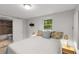 Inviting bedroom showcasing a comfy bed and ensuite bath, offering a relaxing retreat within the home at 1585 San Gabriel Ave, Decatur, GA 30032