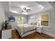 Serene bedroom featuring tray ceilings, hardwood floors, and ample natural light at 1585 San Gabriel Ave, Decatur, GA 30032
