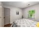 Bright bedroom with ample natural light, a comfy bed, and modern wall art at 1585 San Gabriel Ave, Decatur, GA 30032