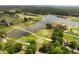 Aerial view of the golf course with lake and clubhouse nearby the real estate at 1585 San Gabriel Ave, Decatur, GA 30032