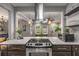 Modern kitchen featuring stainless steel appliances, stone countertops, and eat-in bar area at 1585 San Gabriel Ave, Decatur, GA 30032