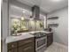 Modern kitchen featuring stainless steel appliances, stone countertops, and eat-in bar area at 1585 San Gabriel Ave, Decatur, GA 30032