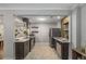 Modern kitchen featuring stainless steel appliances, stone countertops, and patterned floors at 1585 San Gabriel Ave, Decatur, GA 30032