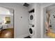Convenient laundry closet featuring a stacked washer and dryer set, optimizing space and adding functionality to the home at 1585 San Gabriel Ave, Decatur, GA 30032