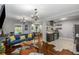 Open-concept living room flowing into the kitchen with modern appliances and ample counter space at 1585 San Gabriel Ave, Decatur, GA 30032