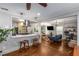 Open-concept living area showcasing a kitchen bar, hardwood floors, and comfortable seating at 1585 San Gabriel Ave, Decatur, GA 30032