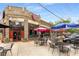 Mojo Pizza Pub offers a welcoming patio with outdoor seating and colorful umbrellas at 1585 San Gabriel Ave, Decatur, GA 30032