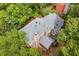 Stunning aerial view of a home highlighting its roof, chimney, deck and beautiful surroundings at 2144 Lamplight Dr, Marietta, GA 30062