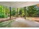 Large covered back porch with wooded views at 2144 Lamplight Dr, Marietta, GA 30062