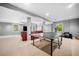 Finished basement offers a recreational area with an exercise machine and comfortable lounge space at 2144 Lamplight Dr, Marietta, GA 30062