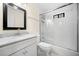 White bathroom featuring a shower and tub combination with marble countertop sink and mirror at 2144 Lamplight Dr, Marietta, GA 30062