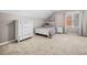 Bedroom with neutral carpet, sloped ceilings, and white furniture creates a cozy and inviting space at 2144 Lamplight Dr, Marietta, GA 30062