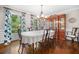 Elegant dining room featuring hardwood floors, chandelier, natural light, and stylish curtains at 2144 Lamplight Dr, Marietta, GA 30062