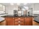 Bright kitchen featuring stainless appliances, dark countertops, white cabinets, and large central island at 2144 Lamplight Dr, Marietta, GA 30062
