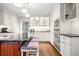 Bright kitchen featuring stainless appliances, dark countertops, white cabinets and central island seating at 2144 Lamplight Dr, Marietta, GA 30062