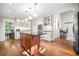 Bright kitchen with stainless steel appliances, custom cabinets, hardwood floors, and large central island at 2144 Lamplight Dr, Marietta, GA 30062