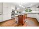 Modern kitchen featuring white cabinets, stainless steel appliances, and a center island with seating at 2144 Lamplight Dr, Marietta, GA 30062