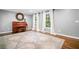 Comfortable living room with large windows, hardwood floors and piano that create a relaxing atmosphere at 2144 Lamplight Dr, Marietta, GA 30062