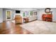 Spacious living room featuring hardwood floors, a fireplace, and an abundance of natural light at 2144 Lamplight Dr, Marietta, GA 30062