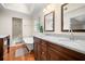 Bright primary bathroom with double vanity, walk-in shower, clawfoot tub, and hardwood floors at 2144 Lamplight Dr, Marietta, GA 30062
