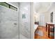 Modern walk-in shower with tile, glass doors, and a view of the main bathroom at 2144 Lamplight Dr, Marietta, GA 30062