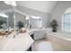 Bright bathroom features dual vanity, large mirrors, a garden tub, and a window, creating a spa-like retreat at 5042 Southland Dr, Woodstock, GA 30188
