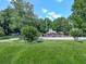 Beautiful community area with landscaping, play area, and clubhouse surrounded by lush green trees at 5042 Southland Dr, Woodstock, GA 30188